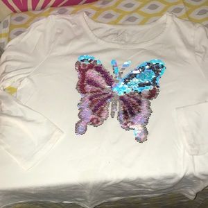 White long sleeved t-shirt with color changing butterfly on front. Size Lg